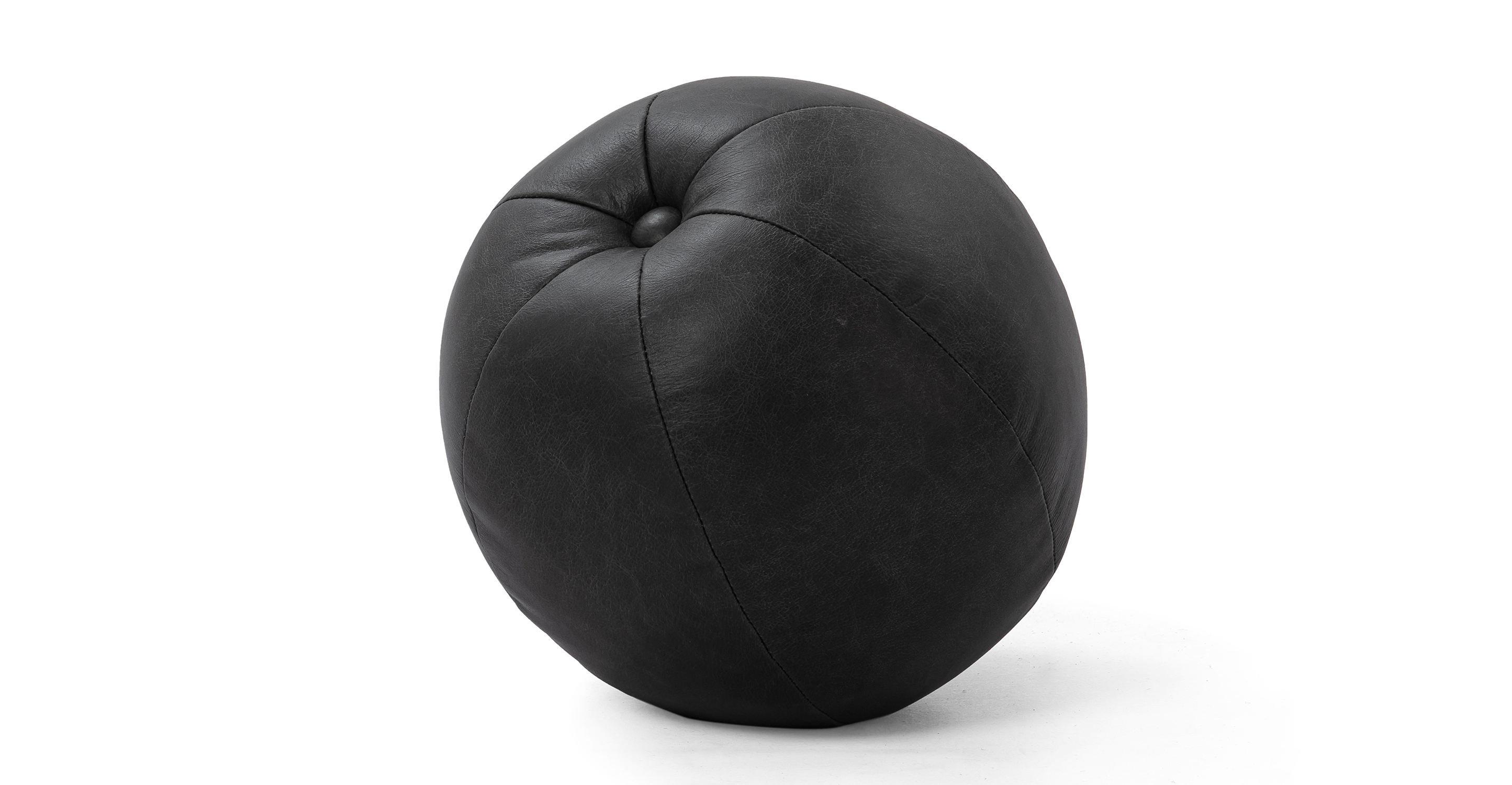 Image shows one large (12" diameter) Mid-Century Orb soft throw pillow in Ebony Black Leather. One tufted button at the top of the pillow, with Kardiel tag on the side. 