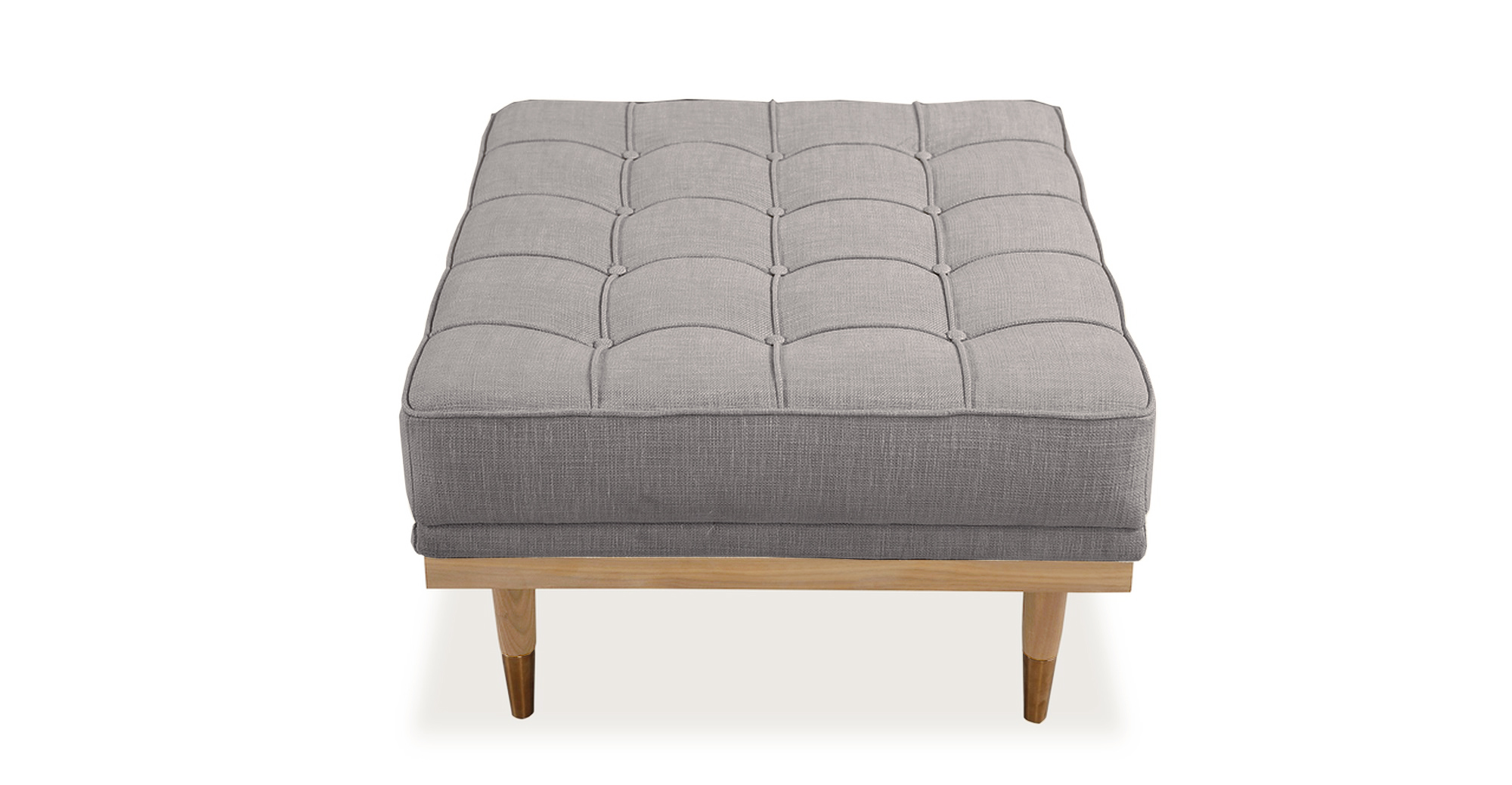 Image shows top view of Mid-Century Modern Woodrow Box Ottoman in Urban Hemp Vintage Tailored Twill. Frame and legs are natural ash wood. Legs are brass tipped ash wood. The cushion is button tufted. 