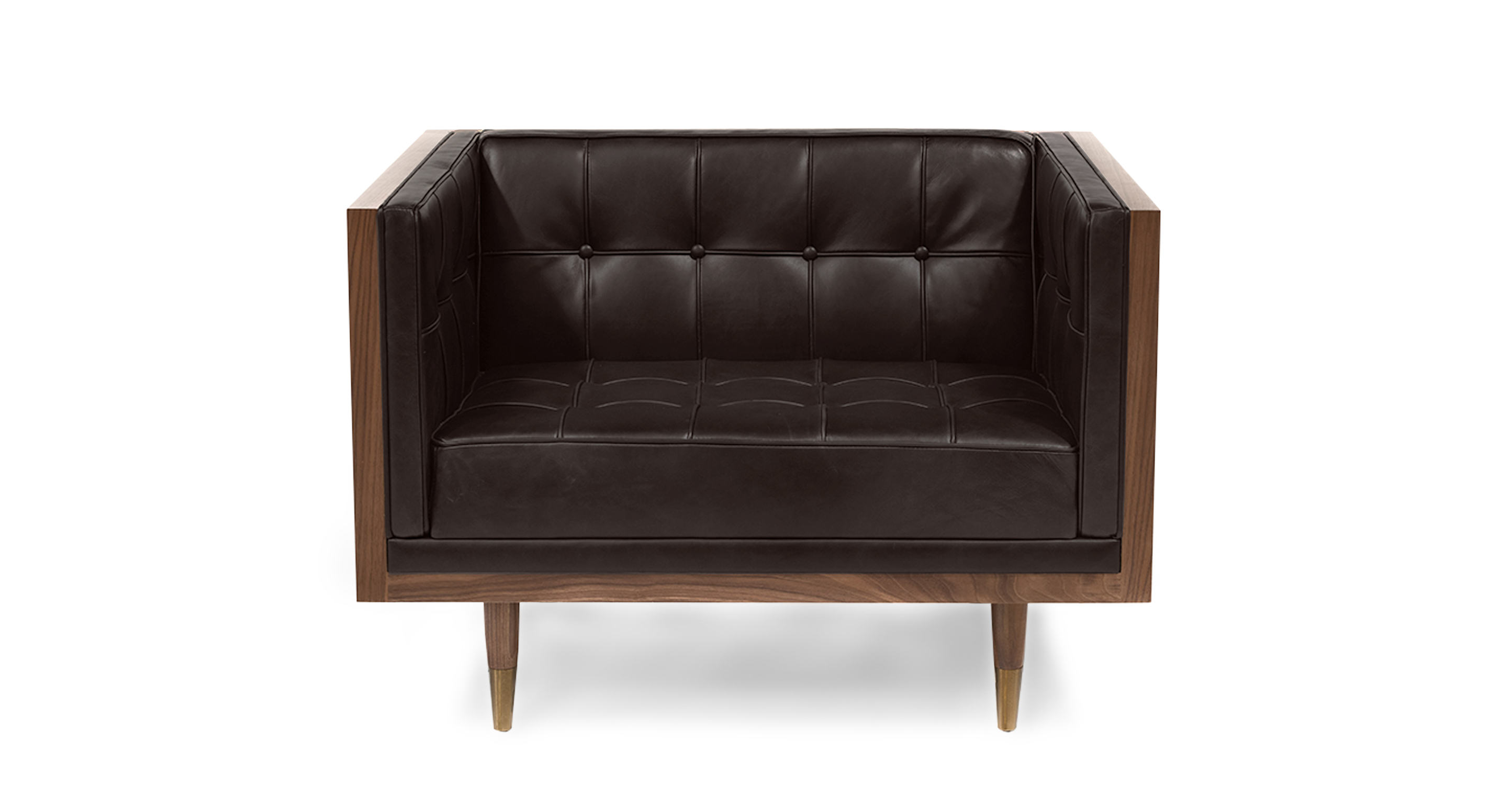 Image shows front picture of Kardiel's Mid-Century Modern Woodrow Box walnut wood wrapped chair in Saddle Black Leather. The boxy shaped chair has button tufted back, seat and side cushions. The chair's legs are brass tipped walnut wood. 